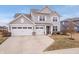 Beautiful two-story home with a spacious driveway and a three-car garage in a residential area at 5646 Mahogany Dr, Noblesville, IN 46062