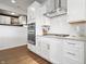 A close up of the kitchen features white cabinetry, granite countertops, and stainless steel appliances at 5646 Mahogany Dr, Noblesville, IN 46062
