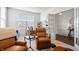 Cozy living room featuring comfortable recliners, a work desk and French doors to another area at 5646 Mahogany Dr, Noblesville, IN 46062