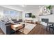 Bright and spacious living room with a large sectional sofa, a fireplace, and plenty of natural light at 5646 Mahogany Dr, Noblesville, IN 46062
