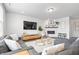 Inviting living room featuring a fireplace, television, comfortable seating, and stylish accents at 5646 Mahogany Dr, Noblesville, IN 46062