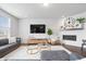 Bright living room with a cozy fireplace, modern decor, and a comfortable seating area at 5646 Mahogany Dr, Noblesville, IN 46062