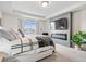 Comfortable main bedroom with a fireplace, mounted TV, neutral decor, and recessed lighting at 5646 Mahogany Dr, Noblesville, IN 46062