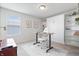 Home office with a modern desk, a chair on a carpet, and a stylish murphy bed at 5646 Mahogany Dr, Noblesville, IN 46062