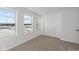 Bedroom featuring neutral carpet, two windows, and a closet at 7062 Nine Penny Dr, Brownsburg, IN 46112
