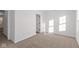 Bright, airy bedroom with neutral carpet, white walls, and abundant natural light at 7062 Nine Penny Dr, Brownsburg, IN 46112
