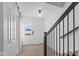 Bright entryway features wood-look flooring, sliding door, and modern light fixture at 7062 Nine Penny Dr, Brownsburg, IN 46112