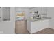 Kitchen featuring white cabinets, quartz countertops, and stainless steel appliances at 7062 Nine Penny Dr, Brownsburg, IN 46112
