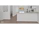 A bright, modern kitchen with stainless steel appliances, sleek countertops, and an open layout at 7062 Nine Penny Dr, Brownsburg, IN 46112