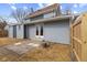A backyard featuring gray vinyl siding, a patio and a wooden fence for privacy at 714 S Keystone Ave, Indianapolis, IN 46203