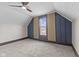 Charming bedroom with vaulted ceilings, carpeted floor and paneled accent wall at 714 S Keystone Ave, Indianapolis, IN 46203