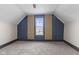 Cozy bedroom with vaulted ceilings, carpeted floor and paneled accent wall at 714 S Keystone Ave, Indianapolis, IN 46203