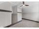 Attic bedroom featuring carpet floors, sloped ceilings, and built-in closet shelves at 714 S Keystone Ave, Indianapolis, IN 46203