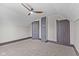Attic bedroom featuring carpet floors, sloped ceilings, and unique closet doors at 714 S Keystone Ave, Indianapolis, IN 46203