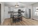 Modern kitchen with white cabinetry, stainless steel appliances, and a center island at 714 S Keystone Ave, Indianapolis, IN 46203