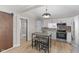 Stylish kitchen featuring white cabinets, stainless appliances, and an eat-in island at 714 S Keystone Ave, Indianapolis, IN 46203