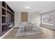 Inviting living room with stylish decor, a fireplace, and ample natural light at 714 S Keystone Ave, Indianapolis, IN 46203