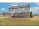 Large backyard featuring a deck, patio, and a well-maintained lawn at 7823 Beechwood Farms Dr, Avon, IN 46123
