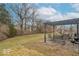 Spacious backyard with a patio area, seating, and mature trees offering shade at 7823 Beechwood Farms Dr, Avon, IN 46123