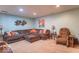 Spacious finished basement with a sectional sofa, cozy armchair, and carpet flooring, perfect for a Gathering room at 7823 Beechwood Farms Dr, Avon, IN 46123