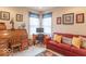 Home office with a desk, comfortable seating, and natural light from a window at 7823 Beechwood Farms Dr, Avon, IN 46123