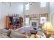 Spacious living room with high ceilings, fireplace, entertainment center, and plush seating at 7823 Beechwood Farms Dr, Avon, IN 46123