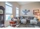 Comfortable living room with a large sectional sofa, wooden accents, and plenty of natural light at 7823 Beechwood Farms Dr, Avon, IN 46123