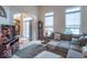 Bright living room with a sectional sofa, fireplace, and a view of the entryway at 7823 Beechwood Farms Dr, Avon, IN 46123