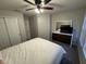 Cozy bedroom features a ceiling fan, dresser with mirror, and a window with natural light at 785 Country Gate Dr, New Whiteland, IN 46184
