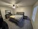 This bedroom features neutral walls and carpet, as well as an expansive window at 785 Country Gate Dr, New Whiteland, IN 46184