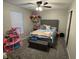 Brightly decorated bedroom featuring bed, vanity, toy storage, and window at 785 Country Gate Dr, New Whiteland, IN 46184