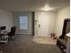 Bright entryway offers a coat rack, shoe storage, and a view of the home office at 785 Country Gate Dr, New Whiteland, IN 46184