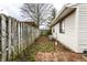 Backyard featuring a wooden fence, an air conditioning unit, and brick pavers at 8004 Minlo Dr, Indianapolis, IN 46227