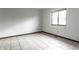 Bright bedroom featuring tile floors, a window with blinds, and neutral paint at 8004 Minlo Dr, Indianapolis, IN 46227