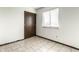Bedroom with neutral walls and flooring, a window, and a closet at 8004 Minlo Dr, Indianapolis, IN 46227