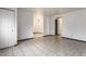 Spacious living room showcases ceramic tile flooring and bright white walls providing a seamless design at 8004 Minlo Dr, Indianapolis, IN 46227
