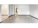 Spacious living room showcases ceramic tile flooring and bright white walls providing a seamless design at 8004 Minlo Dr, Indianapolis, IN 46227