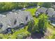 Aerial view shows home's roof, chimney, landscaping, and residential zoning at 8212 Nekton Ln, Indianapolis, IN 46236