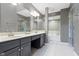 Elegant bathroom featuring a double vanity, soaking tub and glass enclosed shower at 8212 Nekton Ln, Indianapolis, IN 46236