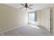 Bright bedroom offering soft carpet, a neutral color palette and large window at 8212 Nekton Ln, Indianapolis, IN 46236