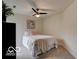 Bedroom featuring soft carpet, a single bed and bright window light at 8212 Nekton Ln, Indianapolis, IN 46236