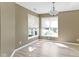 Bright dining room features neutral walls, a modern chandelier, and lots of natural light at 8212 Nekton Ln, Indianapolis, IN 46236