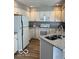 Bright kitchen featuring white appliances, granite countertops, and modern cabinets at 8212 Nekton Ln, Indianapolis, IN 46236