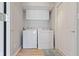 Laundry room featuring washer, dryer and white storage cabinets at 8212 Nekton Ln, Indianapolis, IN 46236