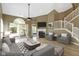 Spacious living room features hardwood floors, a fireplace, and a sliding door with outside access at 8212 Nekton Ln, Indianapolis, IN 46236