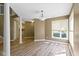 Bright, open living space featuring modern flooring, neutral walls, and a large window at 8212 Nekton Ln, Indianapolis, IN 46236