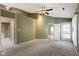 Spacious primary bedroom featuring a ceiling fan, walk-in closet and adjoining bath at 8212 Nekton Ln, Indianapolis, IN 46236