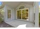 Enclosed patio featuring sliding glass doors and a separate entrance offers a serene outdoor space at 8212 Nekton Ln, Indianapolis, IN 46236