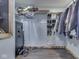 Spacious closet with clothing racks, shoe storage, and security safe at 912 Sweetbriar Ave, Whiteland, IN 46184