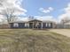 Charming single-story home boasts blue siding, white trim, and a well-maintained front yard at 912 Sweetbriar Ave, Whiteland, IN 46184